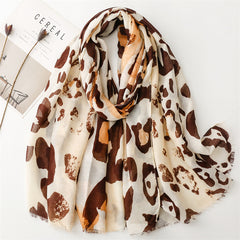 Spring and summer four seasons thin cotton and linen feel scarf European and American cloud leopard print rough edge scarf warm shawl women